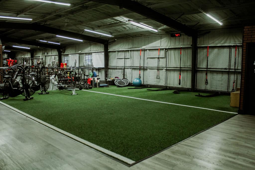 Legacy Barbell Turf Flooring in Gym with Endurance Equipment