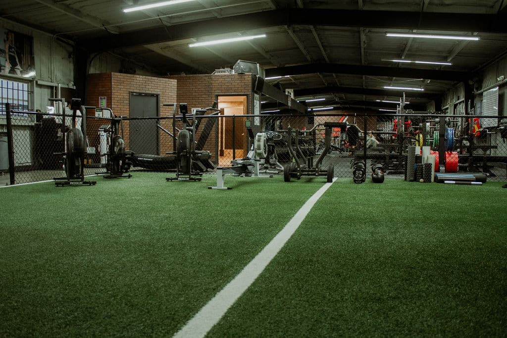Turf Flooring with Exercise bikes at Legacy Barbell Gym